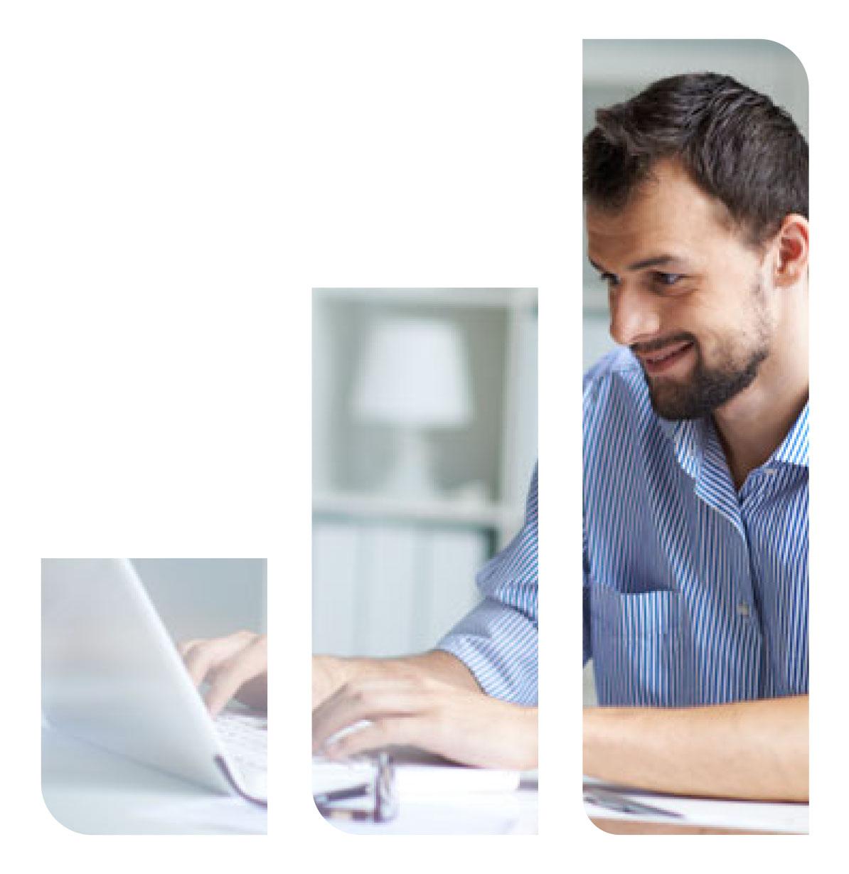 Beardy bloke looking at a computer